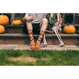 sock model, pumpkin, halloween, flames, fire, steps, skeleton, green grass, flaming  devil socks.