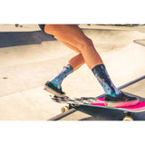 skate socks, skateboard, skate bowl, slide, action shot, action sports.