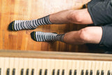 piano socks with an actual piano, brown, wood, shorts, piano socks with piano keys.