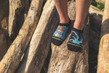 No show socks in action, logs, beach, toes, durable, outdoors.