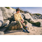 Jimbo Phillips, yellow pier, beach, rocks, moss, green pants, jumbo.
