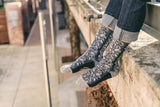 live action socks, modeled socks, jeans, plumbing, black arch, grey heel and toe.