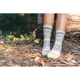 forest, fallen log, calf, live shot of socks.