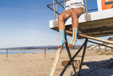 beach, skateboard, longboard, lifeguard tower, shorts, functional socks