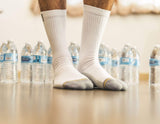 all white socks, plastic bottles, live shot, grey toes, basic unisex crew sock